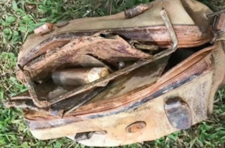 Boy calls the police after fishing an old bag out of the water and looking inside