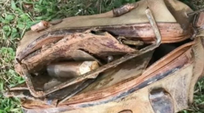 Boy calls the police after fishing an old bag out of the water and looking inside