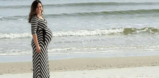 한 남자가 임신한 아내를 촬영하고 뒷배경에서 놀라운 것을 보게 됩니다